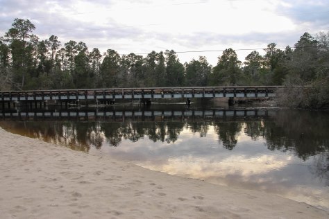 Old Bridge leading to Blackwater River Campground. Beach in the foreground.